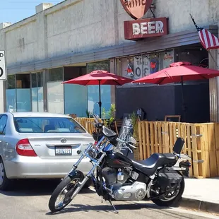 a motorcycle parked in front of a bar