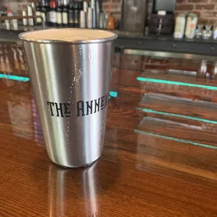 a cup of coffee on the bar