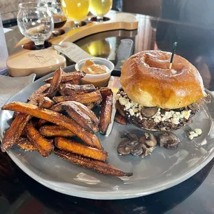 a burger and sweet potato fries