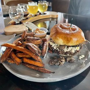 a burger and sweet potato fries