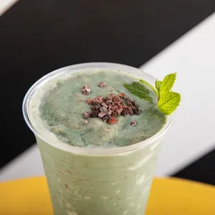 Mint Chocolate Chip Smoothie with choice of milk, banana, fresh mint, spiruina, adaptogens, collagen, cacao nibs, date