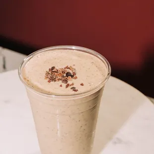 Peanut Butter Protein smoothie with your choice of milk, your choice of protein, plus bananas, cacao nibs, and no added sugars