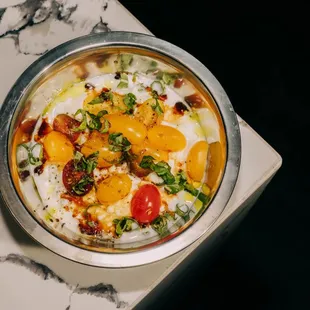 Caprese Cottage Cheese bowl with tomatoes, basil, olive oil, pomegranate molasses, salt, and pepper