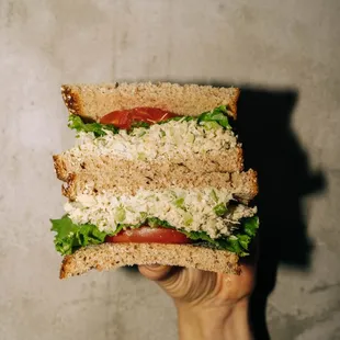 Tuna Salad Sandwich with lettuce, tomato, and multi-grain bread