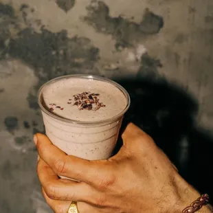 Peanut Butter Protein smoothie with your choice of milk, your choice of protein, plus bananas, cacao nibs, and no added sugars