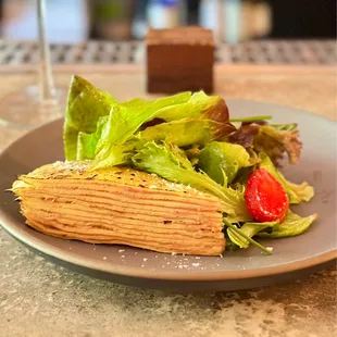 a plate of food and a glass of wine