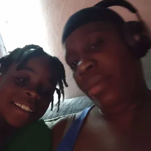 a woman and a girl with headphones