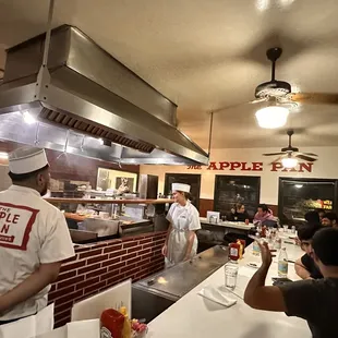 a group of people in a restaurant