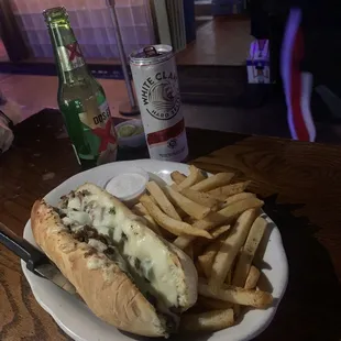 Philly steak sandwich with frues