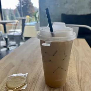 Iced vanilla latte with complimentary lemon cookies.
