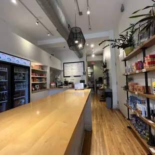 a wooden counter and shelves