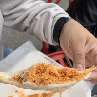 Chicken and cheese empanada, a heaping serving