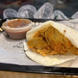 Chicken and cheese arepa with salsa