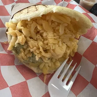 Chicken arepa with a guacamole type sauce mixed in put the pesto type spread or the aoli type spread on these.