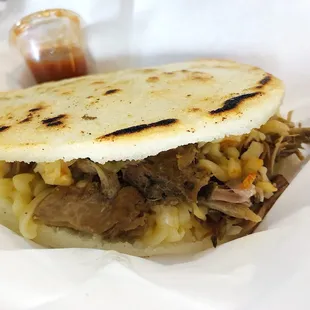 The Piggie (pork + cheee) Arepa with gouda