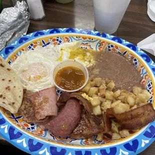 Yummy, a little of everything , ham, bacon, country sausage, pork patties, eggs, potatoes and beans great price!