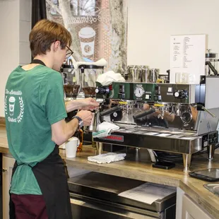 a bari serving a cup of coffee