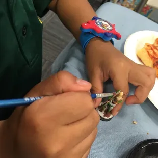 My son painting. Gotta get him started early right?
