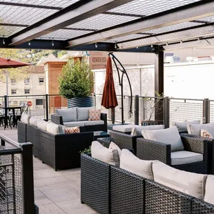 an outdoor patio with furniture