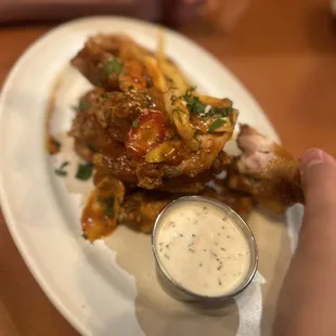 Appetizer of wings, which is big enough for a meal.