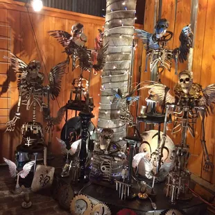 Sculpture garden under the Palm tree by Andre&apos;s Alchemy.