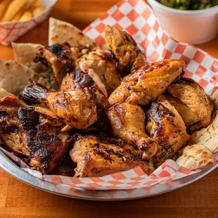 a plate of chicken wings and fries