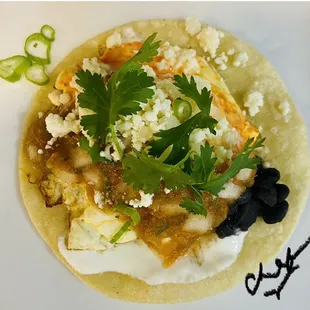 What a Treat Sunny up cage free egg medium smothered with a mild med or hot Salsa Brazil w/black beans, scallions &amp; cilantro - Enjoy! Chef V