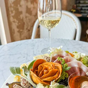 a plate of food and wine