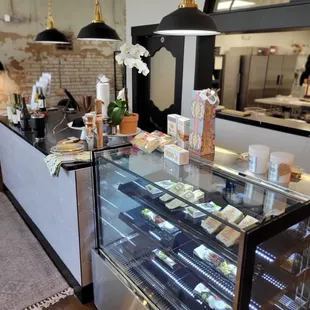 a display case with a variety of pastries