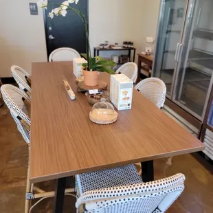 a dining room with a table and chairs