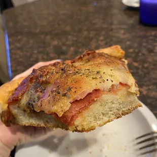 Meaty deep dish. Hardly any sauce is on it - making it very dry. The red you see is the meat and there is no sauce layer underneath.