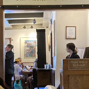 The Artesian Restaurant.  The overworked hostess.