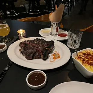 60 day dry aged Porter House medium rare extra char with creamed corn &amp; beef fat fries.