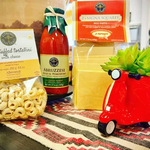 a red scooter with a succulent plant in it