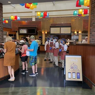 a group of people in a cafeteria