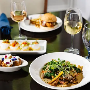 plates of food and glasses of wine