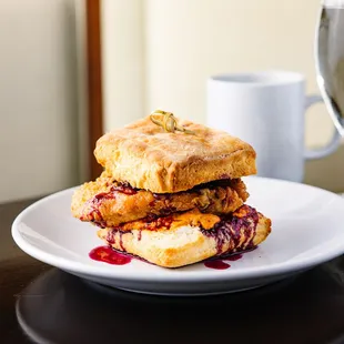 a sandwich and a glass of wine