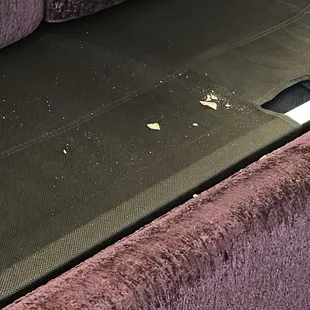 Crumbs under couch cushions - These were there upon check in (we plan to use the pull out bed tonight for our kids)