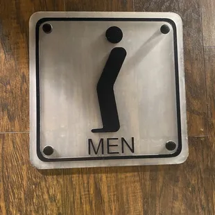 a male toilet sign