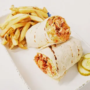 Tender buffalo chicken wrap with fries.