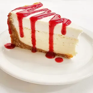 Homemade Cheesecake with homemade raspberry sauce...mmmmm.