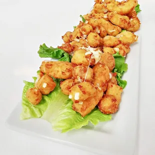 A giant portion of your favorite cheese curds.  Made with  Wisconson white cheddar curds.