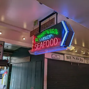 Neon sign in front of restaurant.