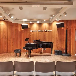 a grand piano and chairs