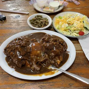  a plate of beef and gravy