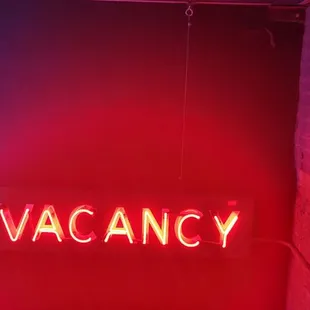 a neon sign that reads no vacancy