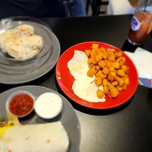 Atomic breakfast burrito and biscuits and gravy with eggs over easy and diced potatoes...