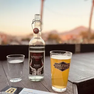 a beer and a glass on a table