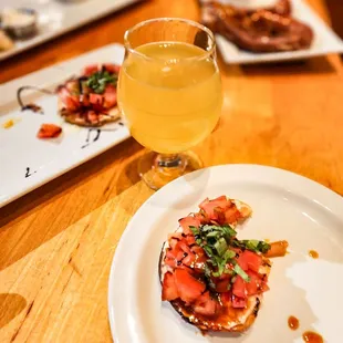 a plate of food and a glass of beer