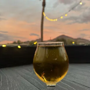 a glass of beer on a table